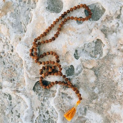 Silhouette of a person balancing on one leg at sunset.